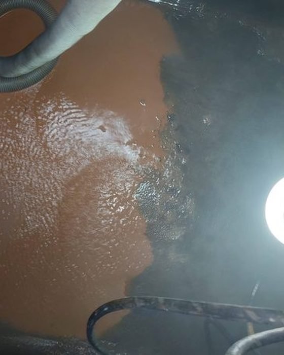 Discoloured, contaminated water inside an underground tank before cleaning in Kalighat, Kolkata